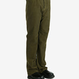 Green pants worn by a person, showing the pants's fit