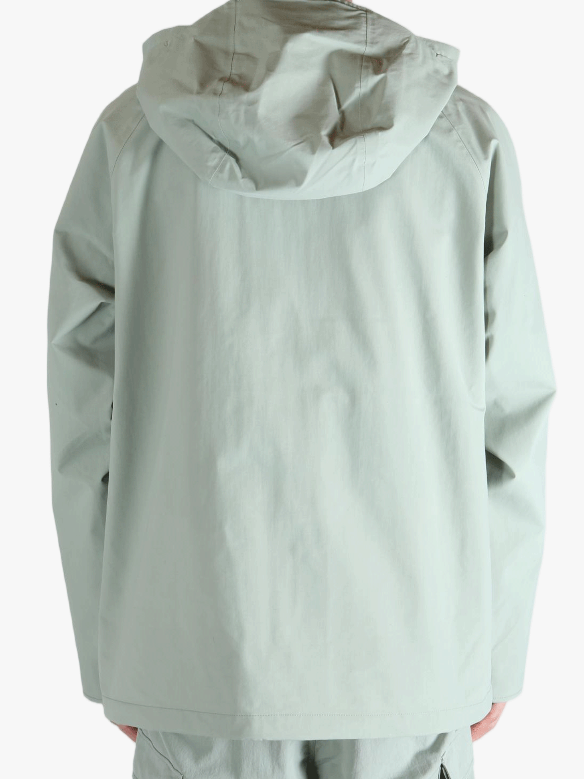 Grey jacket worn by a person, showing the jacket's fit