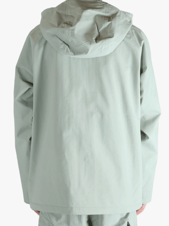 Grey jacket worn by a person, showing the jacket's fit
