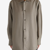 Brown shirt worn by a person, showing the shirt's fit