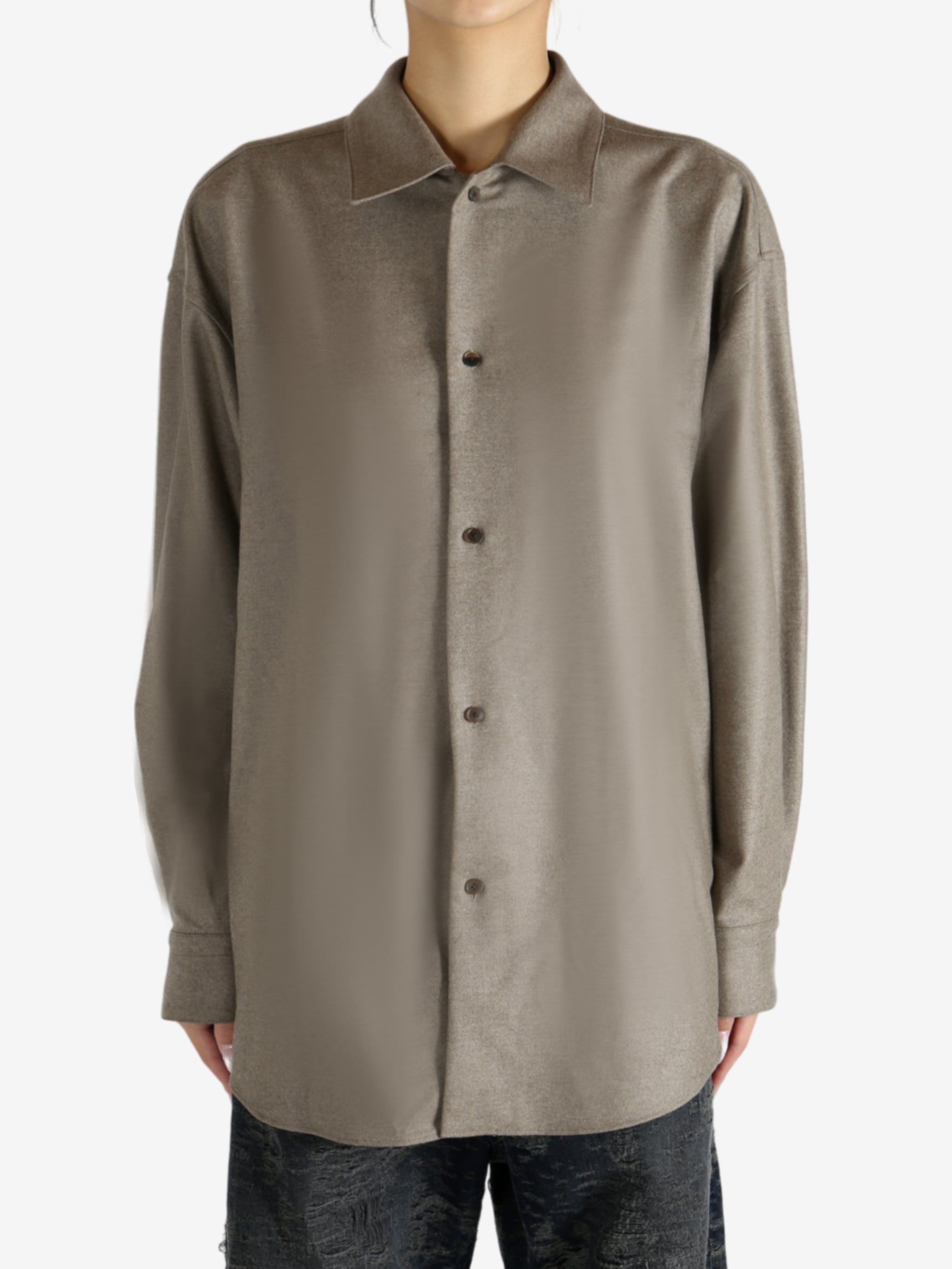 Brown shirt worn by a person, showing the shirt's fit