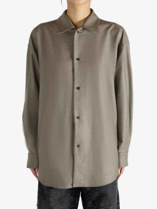 Brown shirt worn by a person, showing the shirt's fit