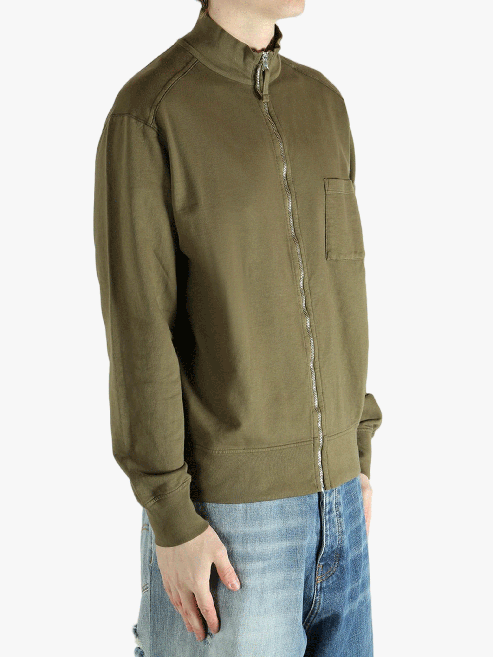 Green jacket worn by a person,showing the jacket fit