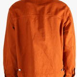 Orange jacket worn by a person, showing the jacket fit