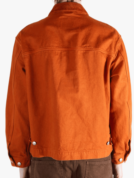 Orange jacket worn by a person, showing the jacket fit