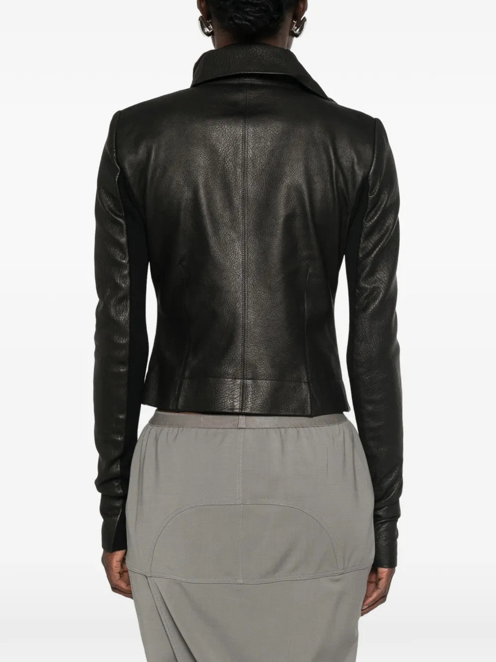 Black jacket worn by a person, showing the jacket fit