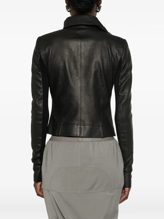 Black jacket worn by a person, showing the jacket fit