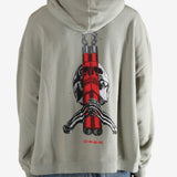 Grey hoodie worn by a person, showing the hoodie's fit