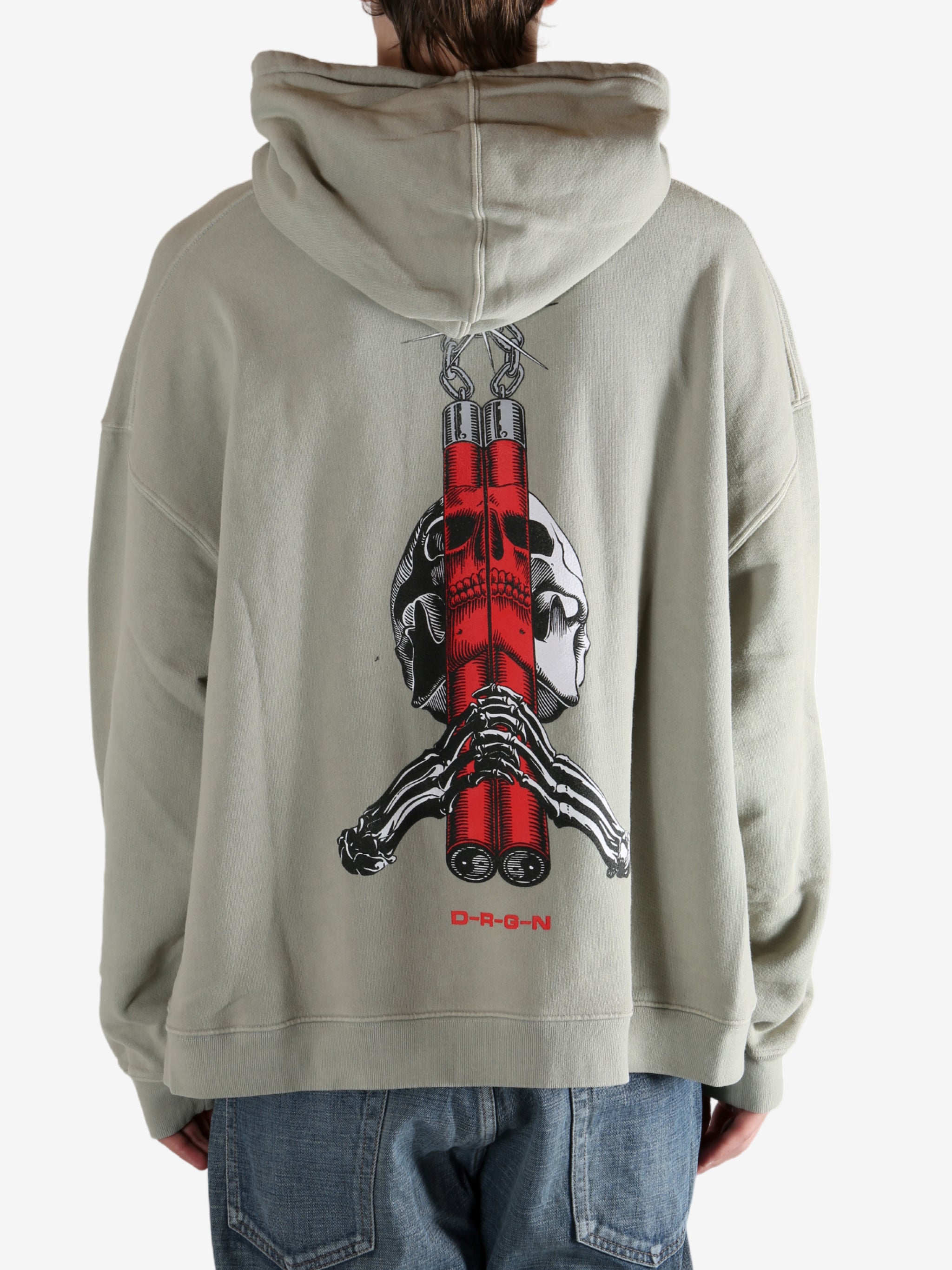 Grey hoodie worn by a person, showing the hoodie's fit