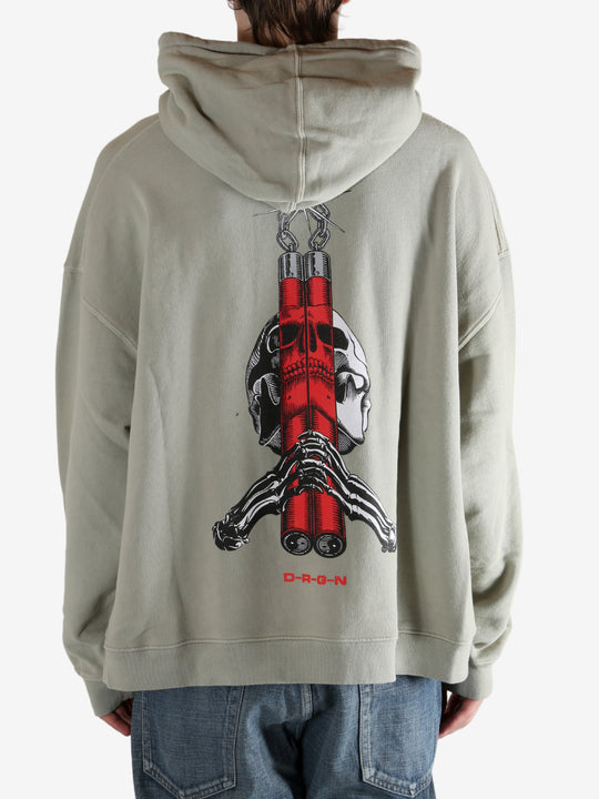 Grey hoodie worn by a person, showing the hoodie's fit