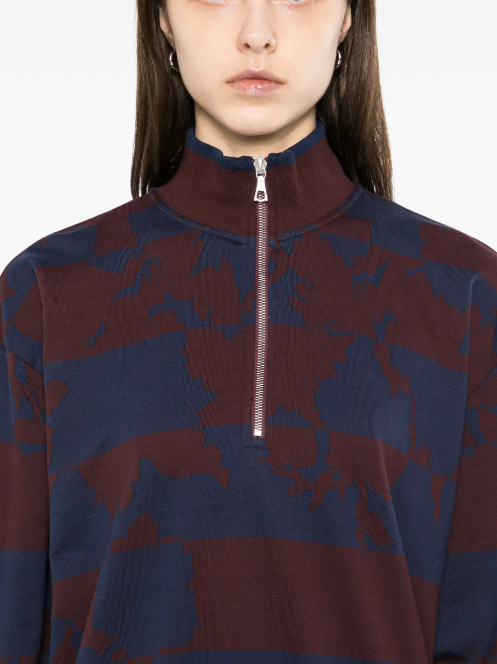 Burgundy sweater,worn by a person, showing the sweater's fit