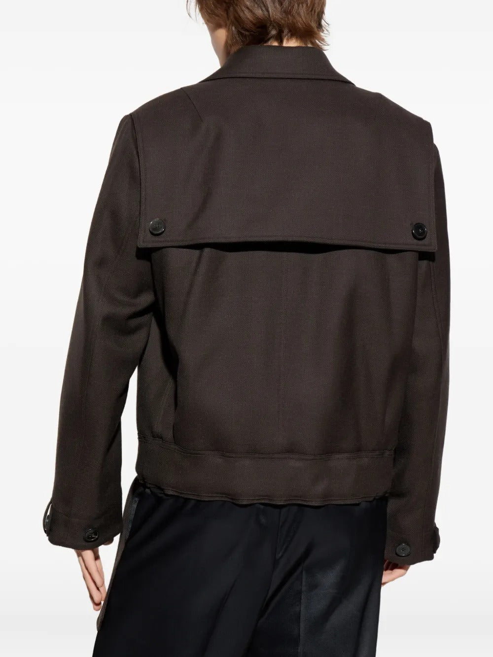 Brown jacket worn by a person, showing the jacket's fit