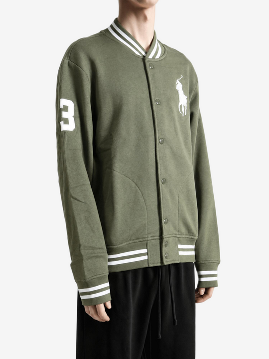 Green jacket worn by a person, showing the jacket fit