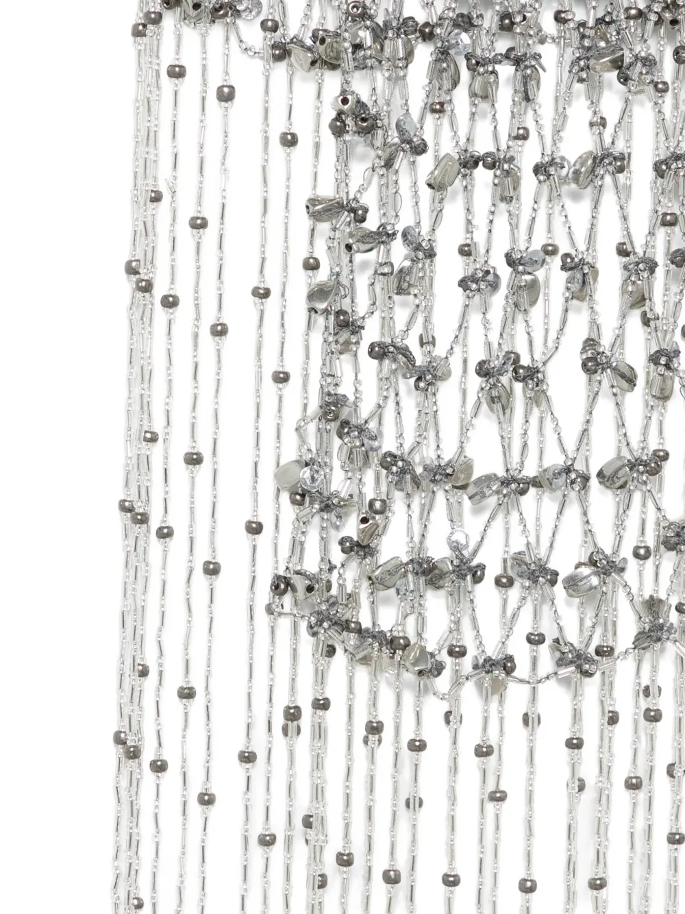 Close up of silver necklace, showing the detail of silver material