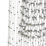 Close up of silver necklace, showing the detail of silver material