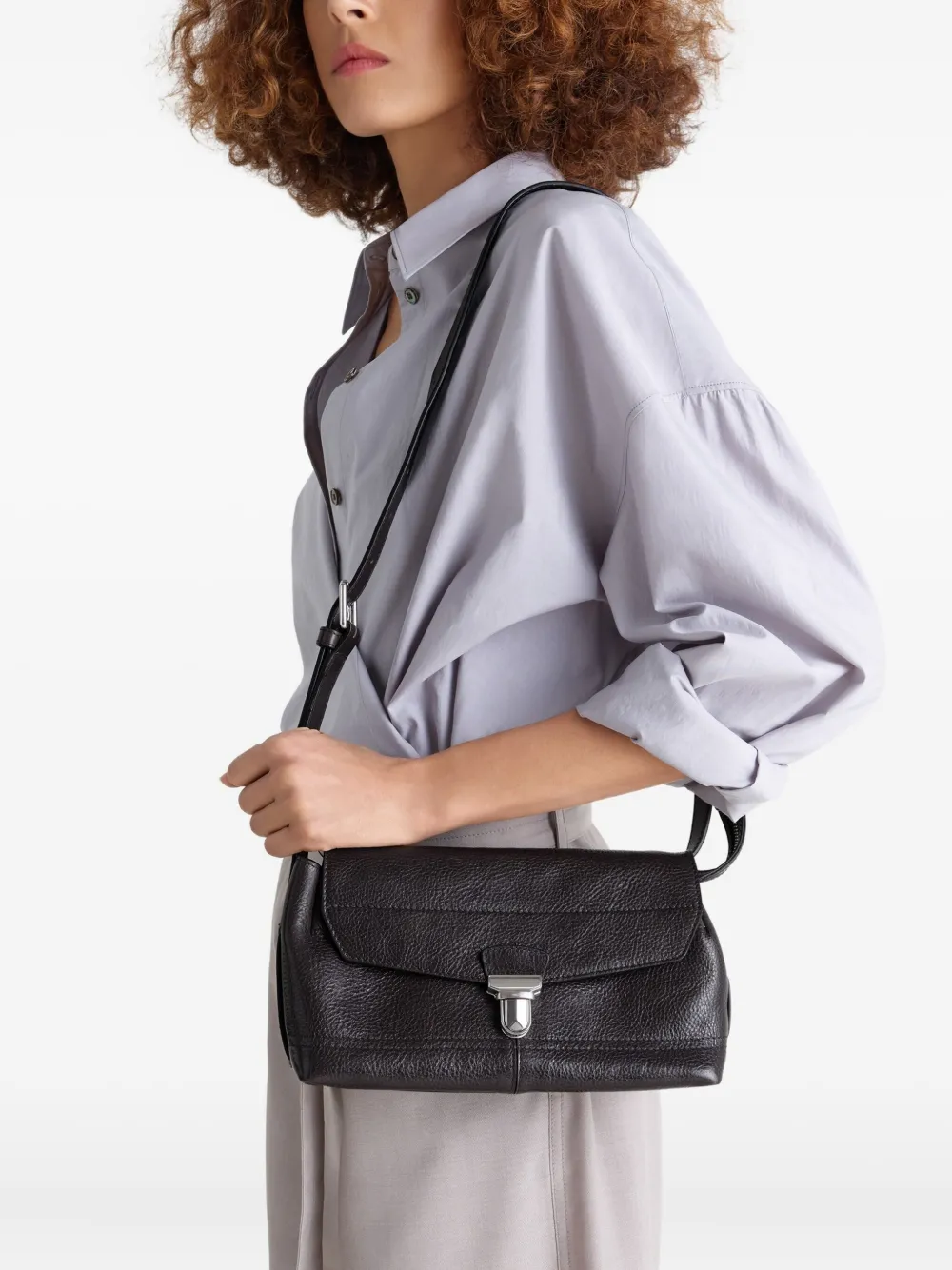 Purple bag worn by a person, showing the bag's fit