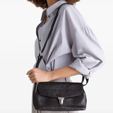 Purple bag worn by a person, showing the bag's fit