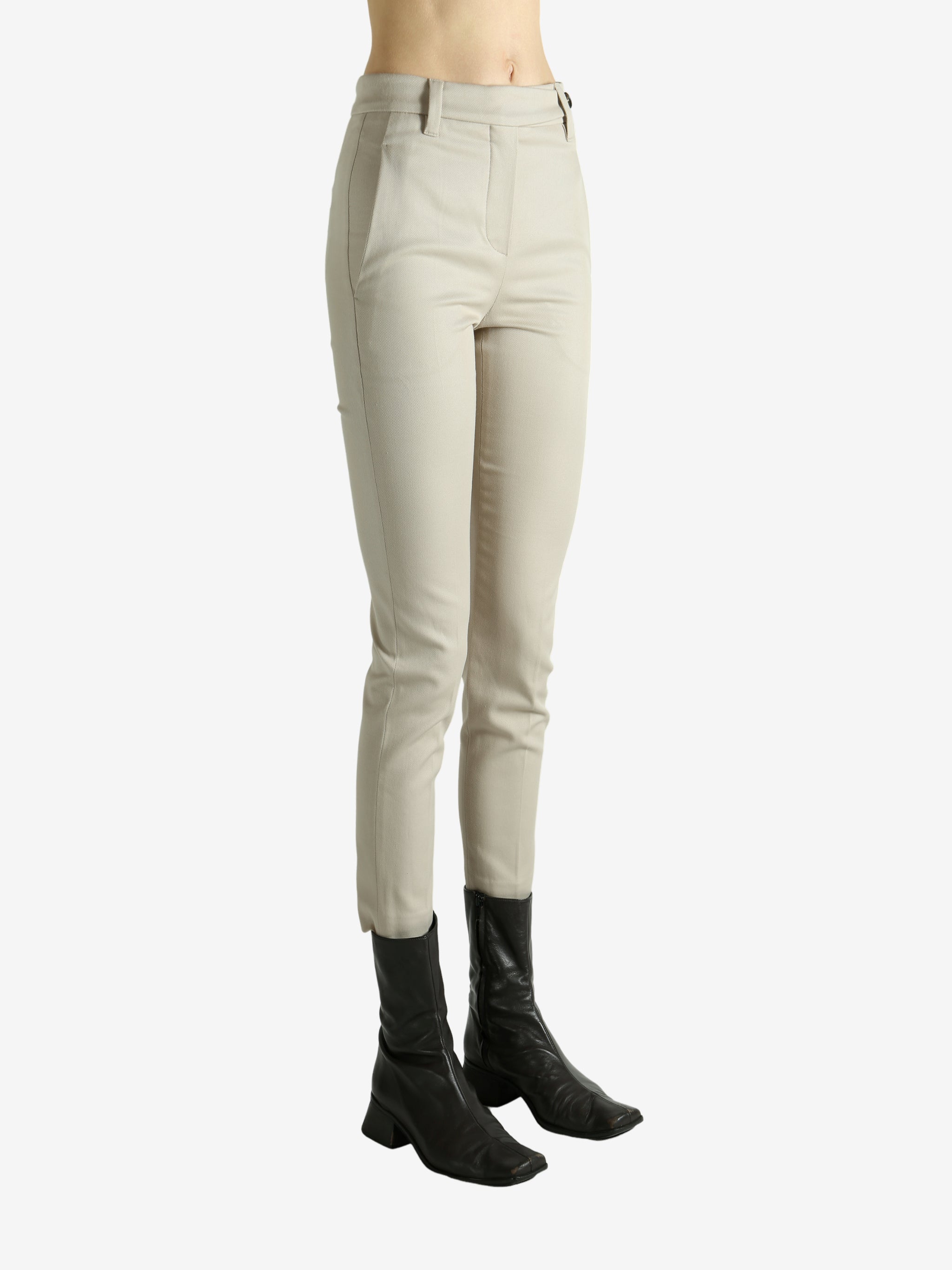 Tan pants worn by a person, showing the pants fit