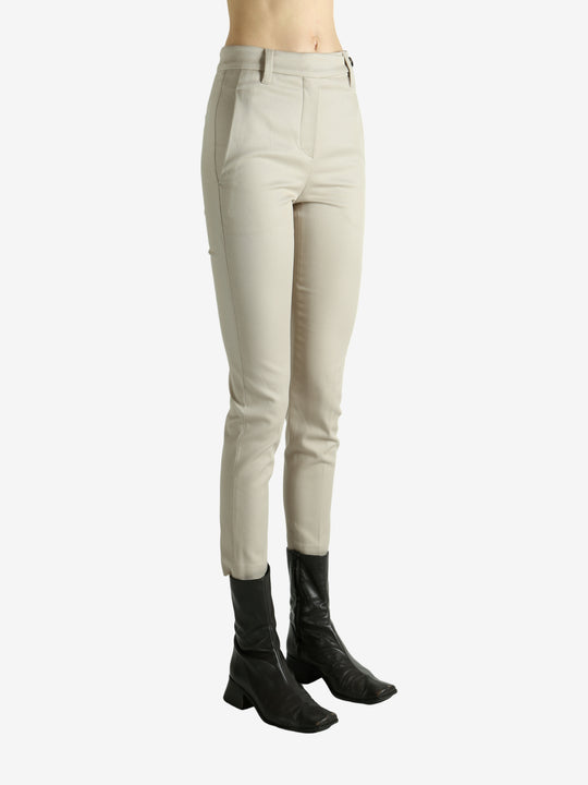 Tan pants worn by a person, showing the pants fit