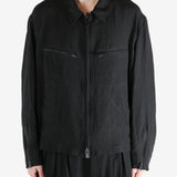 Black jacket worn by a person, showing the jacket's fit