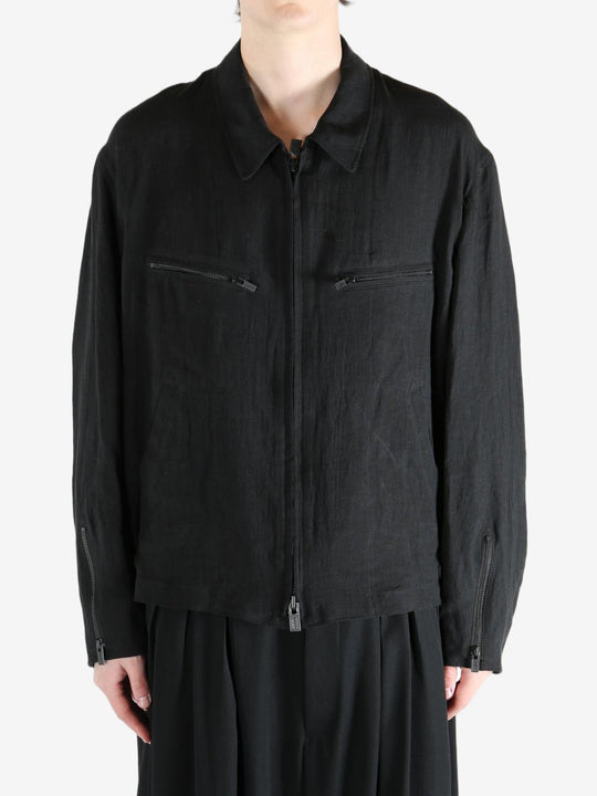 Black jacket worn by a person, showing the jacket's fit