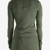 Green t-shirt worn by a person, showing the shirt's fit