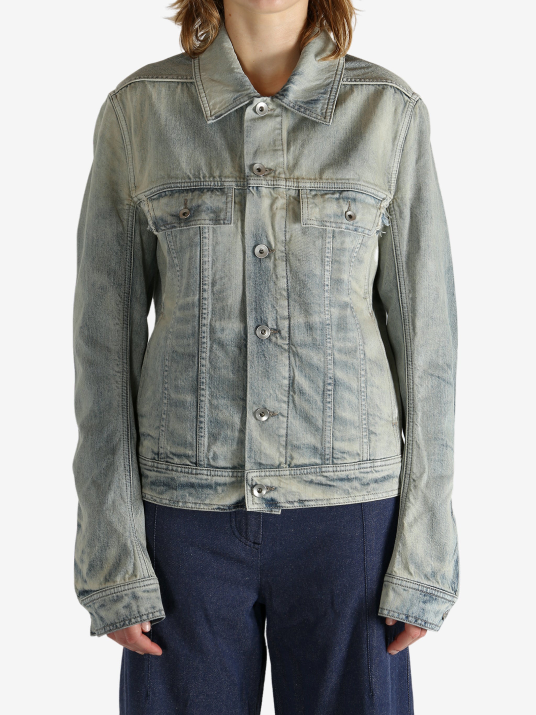 Grey jacket worn by a person, showing the jacket fit