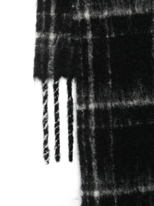 Close up of black scarf,showing texture of the alpaca fabric.
