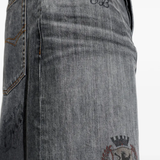 Close up of grey pants, showing texture of the cotton fabric
