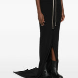 Black skirts worn by a person, showing the skirts fit