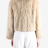 Tan jacket worn by a person, showing the jacket fit