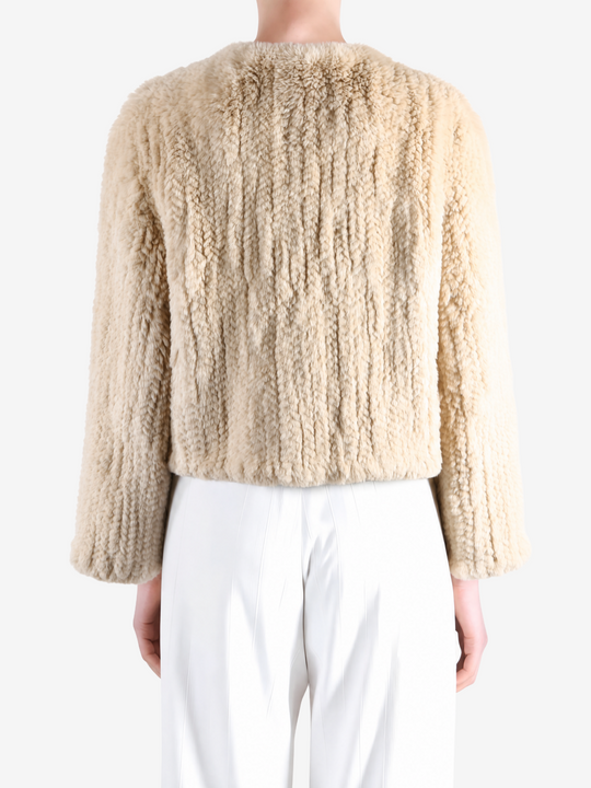 Tan jacket worn by a person, showing the jacket fit