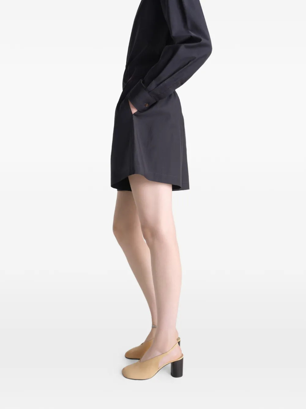 Black short worn by a person, showing the short's fit