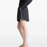 Black short worn by a person, showing the short's fit