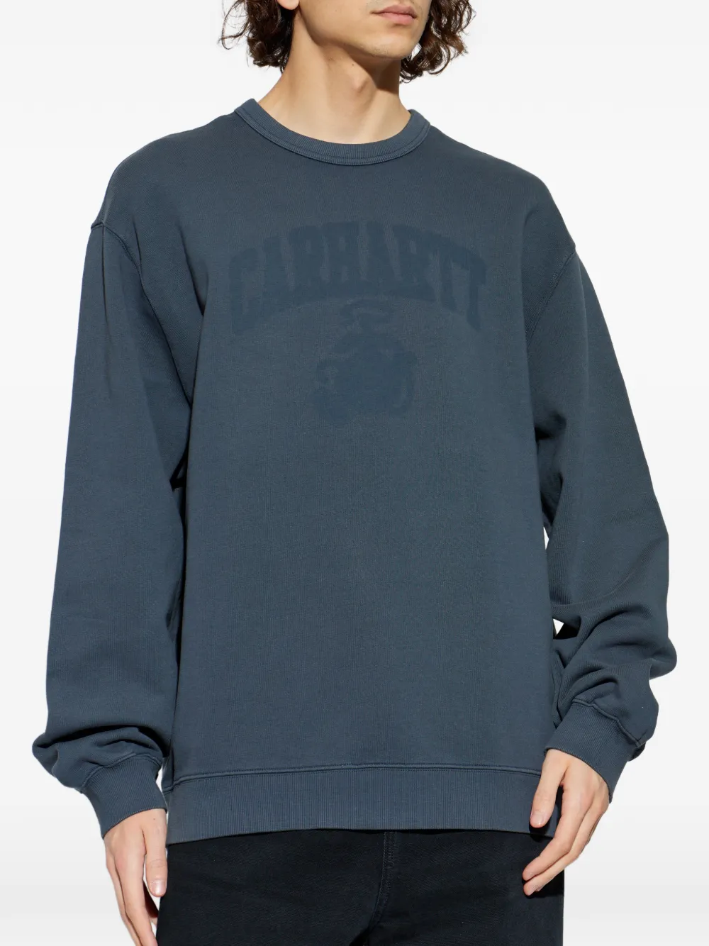 blue sweat, worn by a person, showing the sweat fit