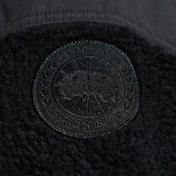 Close up of black jacket,showing texture of the wool fabric.