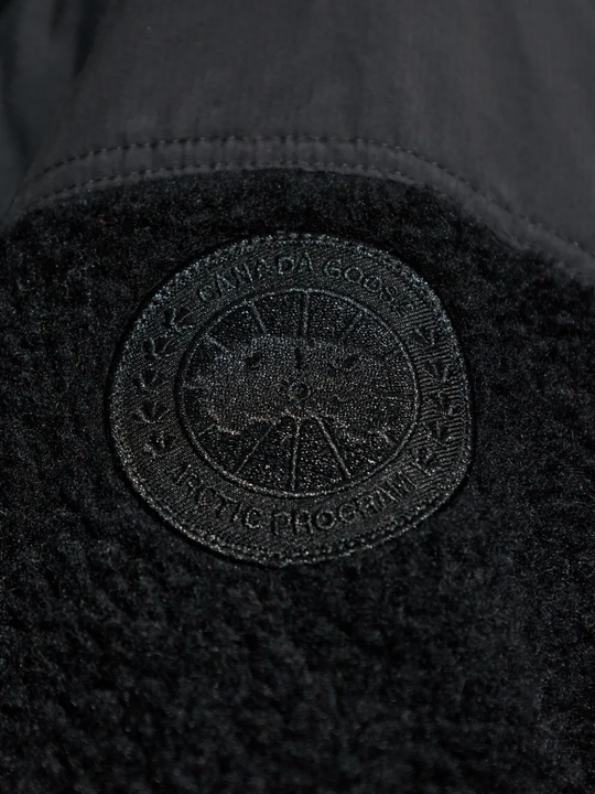 Close up of black jacket,showing texture of the wool fabric.