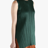 Green dress worn by a person, showing the dress's fit