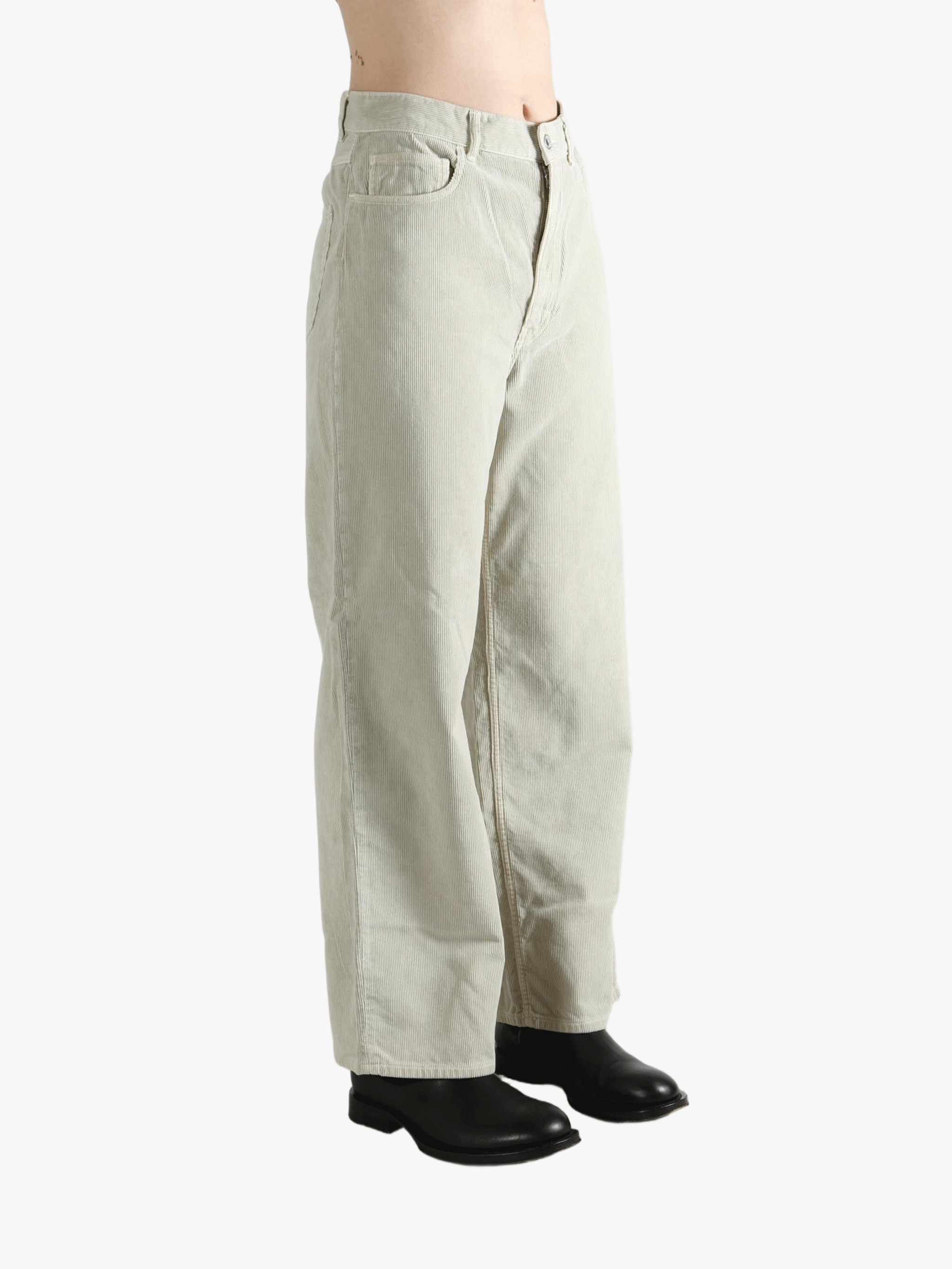 White pants worn by a person, showing the pants' fit