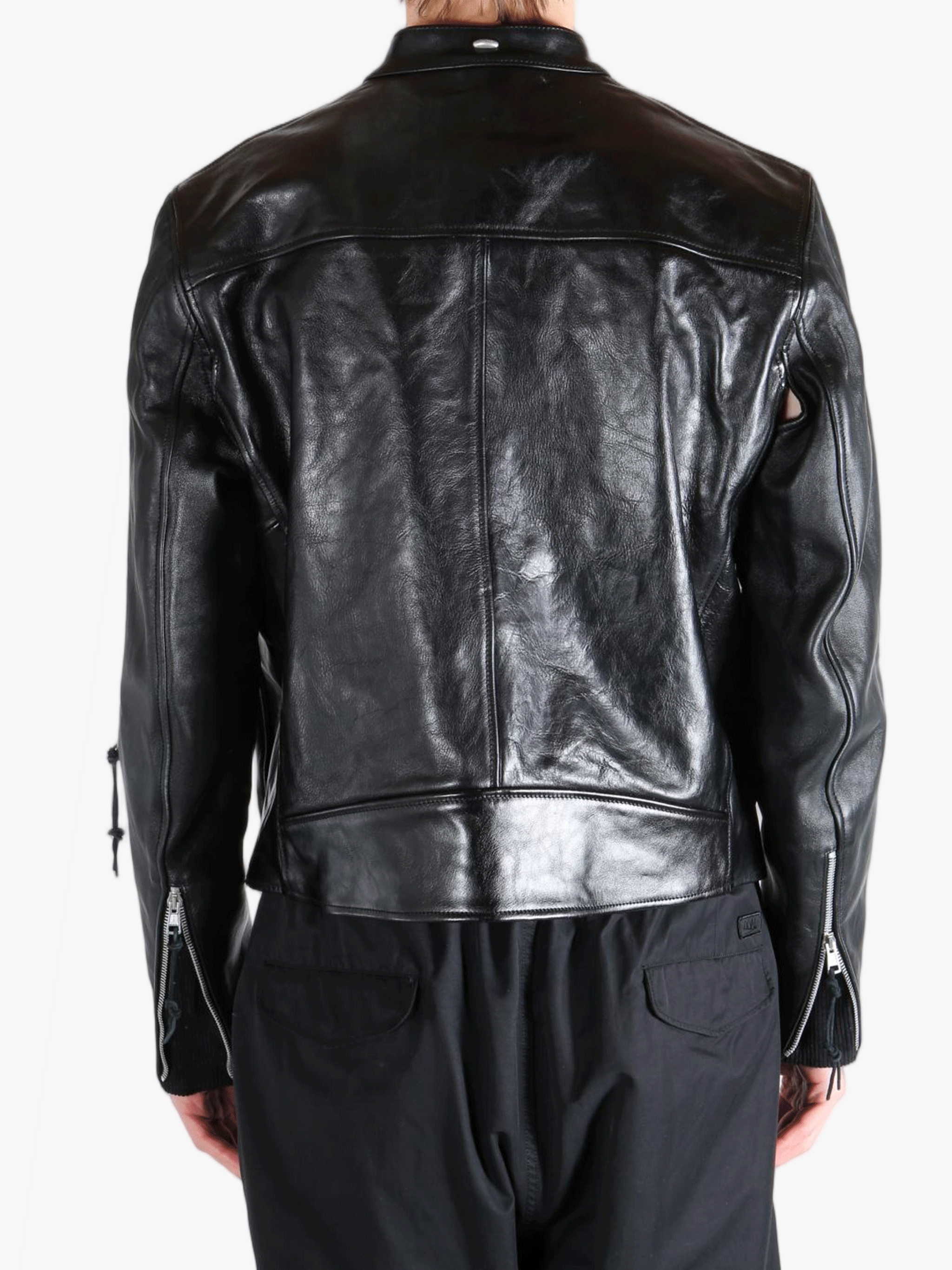 Black leather jacket worn by a person, showing the jacket fit