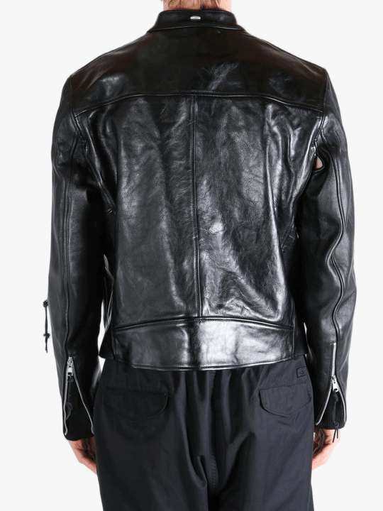 Black leather jacket worn by a person, showing the jacket fit