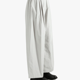 Grey pants worn by a person, showing the pants' fit