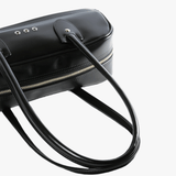 Close up of black handbag,showing texture of the  polyethylene fabric