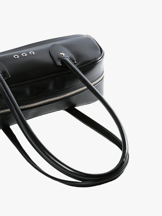 Close up of black handbag,showing texture of the  polyethylene fabric