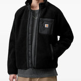 Black jacket worn by a person, showing the jacket fit