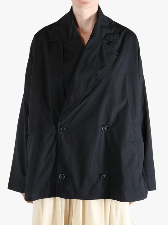 Black jacket worn by a person, showing the jacket fit