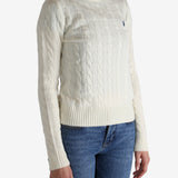 White pullover worn by a person, showing the pullover's fit
