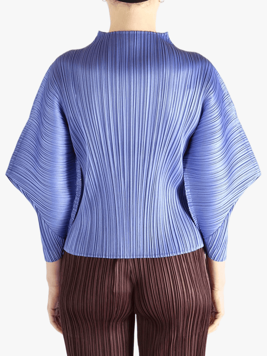 Blue shirt worn by a person, showing the shirt fit