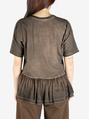 Brown top worn by a person, showing the top's fit