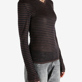 Brown top worn by a person, showing the top's fit